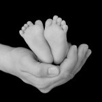 baby-feet-in-hand